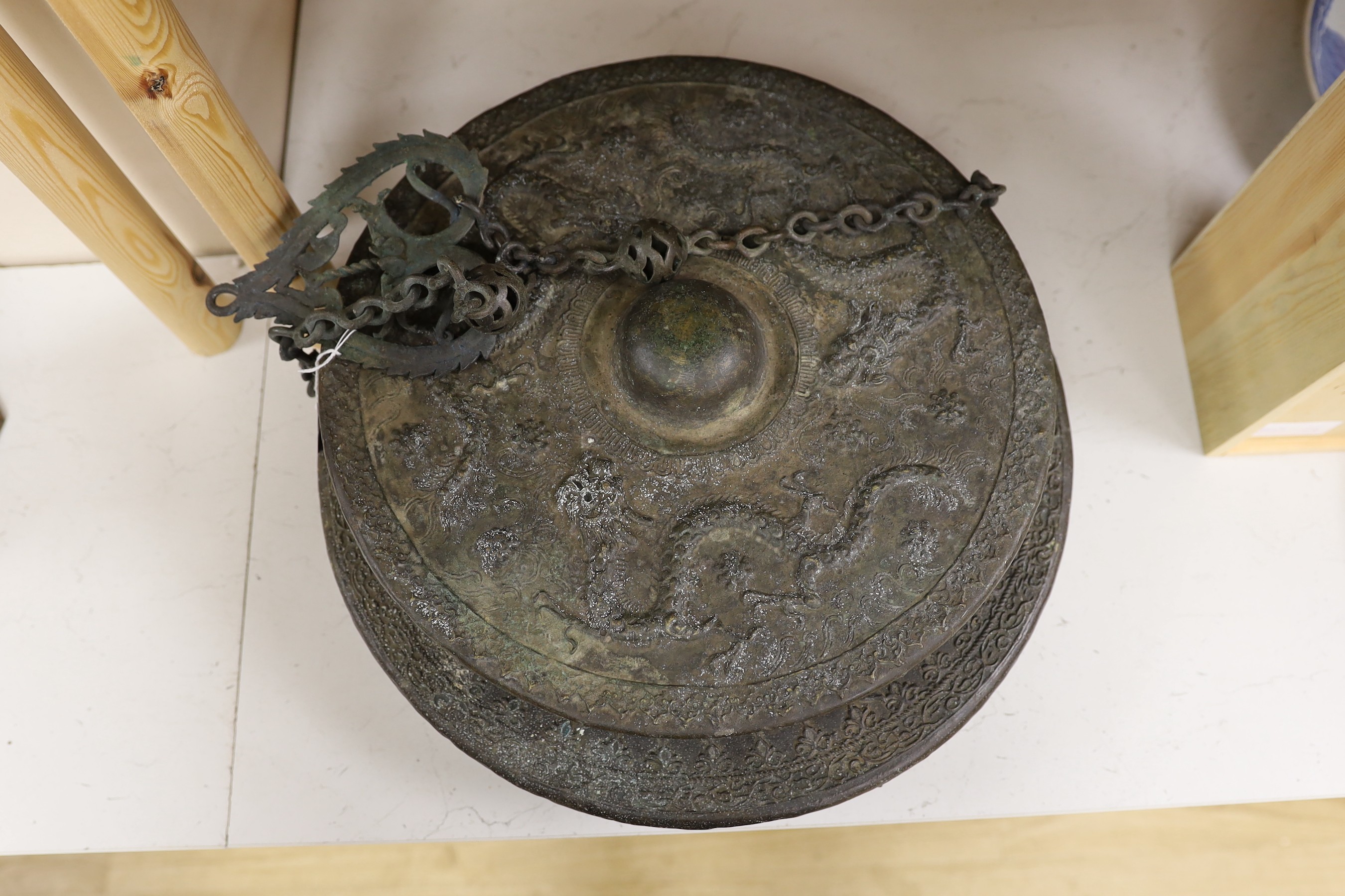 Two 19th century Borneo bronze gongs, Tawak-Tawak, largest 42cm diameter